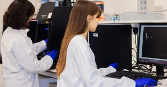 Students collaborating in the AI research lab